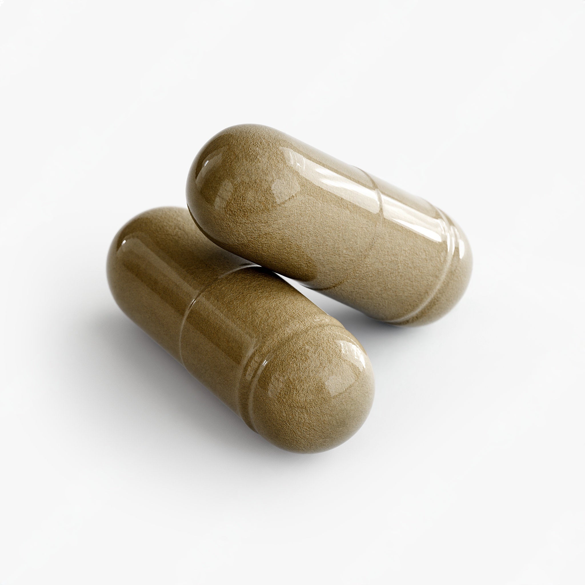 Two brown capsules on a white background