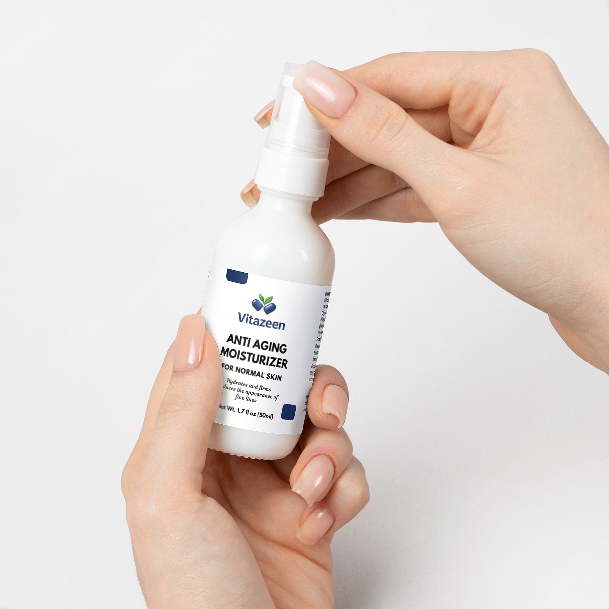 Hand holding a bottle of Vitanzeen Anti Aging Moisturizer against a white background